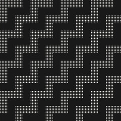 Fototapeta premium Vector geometric seamless pattern with zigzag stripes. Black and white texture with zig zag lines made from small squares, dots. Diagonal chevron background. Simple minimal monochrome repeat design