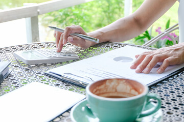 Freelance work concept. Confident busy freelancer in trendy eyewear doing remote job  in workplace