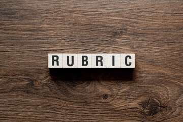 Rubric - word concept on building blocks, text