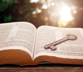 An open retro book on wooden desk