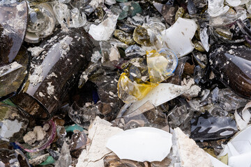 many glass shards of different colors that have partially melted