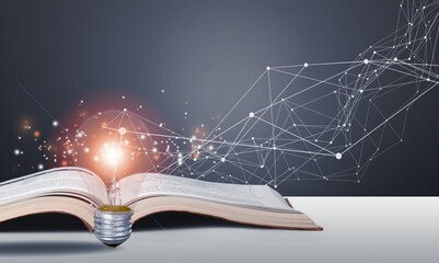creative concept, Bright Light bulb and open Book