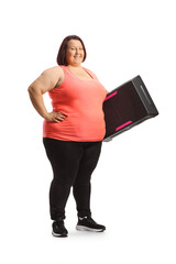 Full length shot of a corpulent woman holding a step aerobic platform