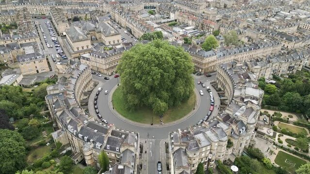 Slow push in aerial view of  Georgian terraced housing in The Circus, Bath, England