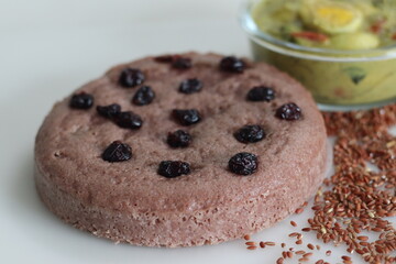 Navara rice vattayappam. Steamed rice cake made with a fermented batter of navara rice and coconut and steamed in a round dish served with kerala egg masala curry