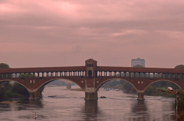 Fototapeta na wymiar The covered bridge of Pavia in a rainy day.