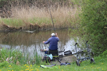 Fototapeta na wymiar Fishermen fishing on the Selby Canal North Yorkshire in the UK
