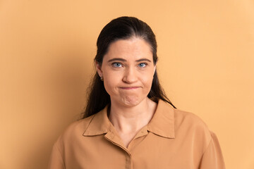 unhappy caucasian woman with sad face expression in studio shot. frustration, unhappy, problem concept.