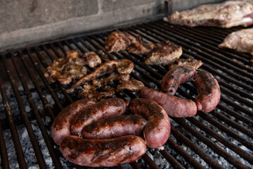Grilled meat with chorizo and brushes. Argentinean Meat