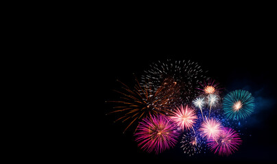 Abstract colored firework background with free space for text. Celebration and anniversary concept on black background Happy New Year, Party concept