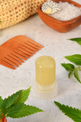 green salt antiperspirant and other care products on the table close-up