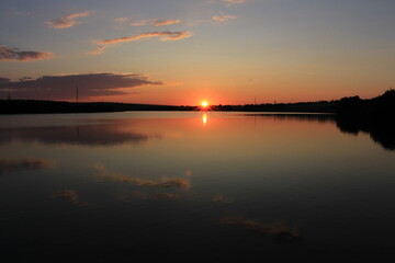 Fototapeta na wymiar A sunset over a lake