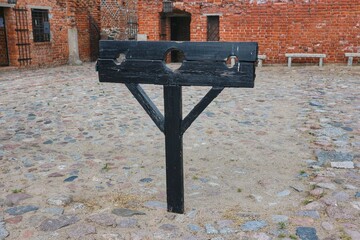 Stocks standing in the courtyard of the medieval Teutonic castle in Brodnica