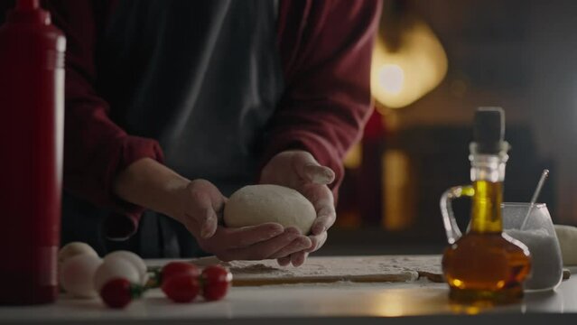 aly, Fast Cooker Dexterously Dough Shapes creates a round shaped pizza in a street bakery Close-u