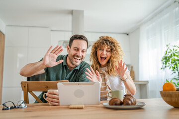 couple husband and wife man woman use digital tablet for video call