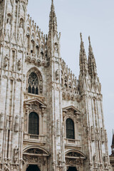 Fototapeta premium Milan, Italy- May 13, 2023: View of the Milano Duomo Cathedral Cathedral. top tourist attraction of Milan. Gothic style cathedral is dedicated to St Mary. located at the Piazza del Duomo square.