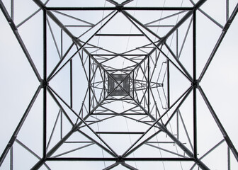 low angle view of steel framework of high voltage tower pole