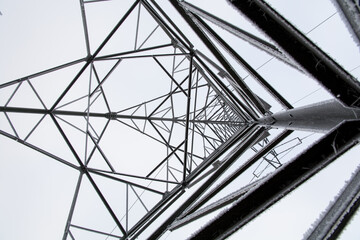 low angle view of steel framework of high voltage tower pole