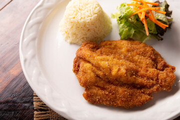 Chicken Milanese. Delicious crispy, quick and easy recipe, made with thin skinless and boneless chicken breasts or cutlets, lightly breaded and deep fried.