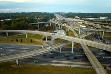 Aerial view of american freeway intersection with fast moving cars and trucks. USA transportation infrastructure concept