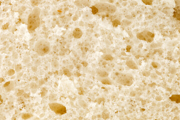 Bread is light, cut and porous structure of baked dough close-up, background