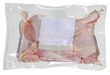 Pieces of chicken meat packed in a plastic bag. Isolated background.