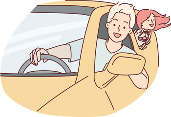 Happy family rides in car leaning out of windows to enjoy summer trip together or trip to mall