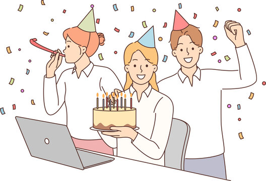 Birthday party with office colleagues and friends from work giving cake and using confetti
