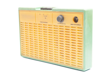 Old transistor radio isolated on white English translation: programs, volume, tape recorder (inscription in Russian).