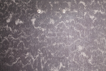 Texture of dark gray paper closeup. Structure of a dense cardboard.
