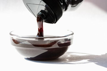 Pouring Date Syrup in a Bowl