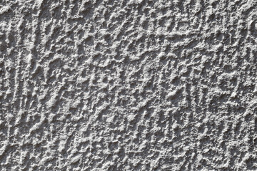 Wall plastered roughly with cement mortar, uniform texture background