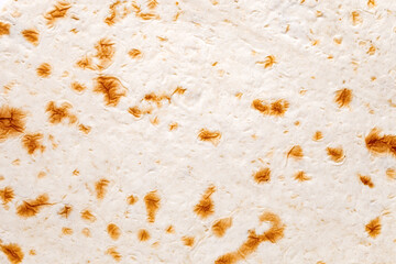 Pita tortilla close-up surface baked, uniform texture background