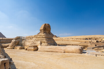 The Great Sphinx at the Giza pyramid complex,  Giza necropolis is home to the Great Pyramid, the Pyramid of Khafre, and the Pyramid of Menkaure, 
 in Cairo, Egypt.  Travel and history.