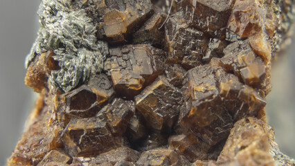 mineral specimen of garnet with the crystals in the foreground