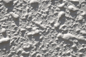 Wall plastered dried drops close-up with cement mortar, uniform texture background