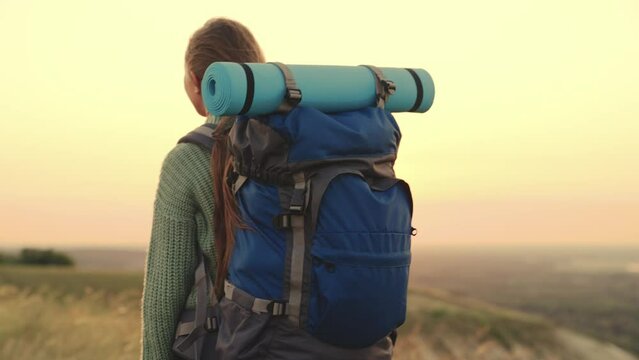 girl traveler runs sunset. millennial hipster girl. young woman with backpack runs sunset. hiking. holiday vacation arms sun. relaxation outdoors. state freedom image happy life. run woman vacation.