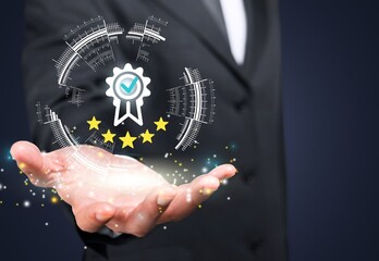 Quality Concept. Business man show quality mark, service, business excellence.