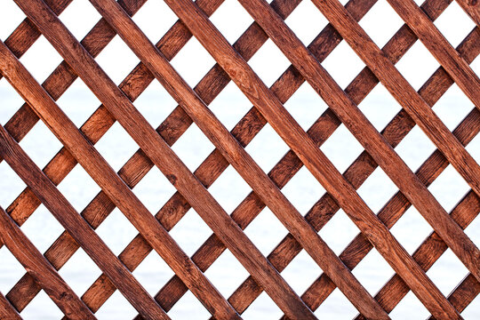 Grid of knocked-down lacquered wooden slats, square cells