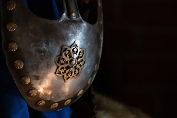 Close-up view of old Russian metal helmet with mask helmet (or visor). Soft focus. Copy space for your text. Medieval armour theme.