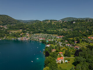 Nature of Italy Lake Orta view from a drone. Aerial View Forest Landscape in Summertime Day. Concept Wildlife and Nature Wide Shot 4k.