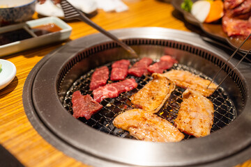 Raw beef and pork slice on grill for barbecue