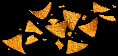 Fotobehang Hete pepers Falling corn chips, hot Mexican nachos isolated on black background