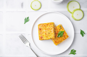 Zucchini carrot cheese bacon casserole slices