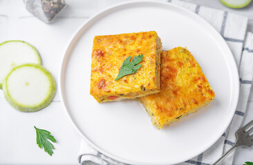 Zucchini carrot cheese bacon casserole slices