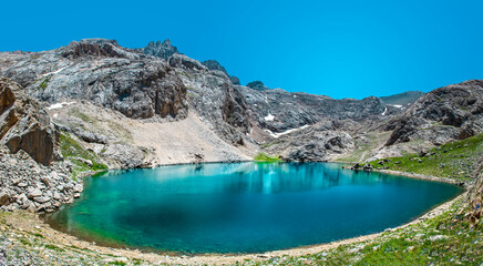 Naklejka na ściany i meble Beautiful panoramic landscape of mountain lake between Bolkar Mountain and Taurus Mountain. Nigde, Turkey. It is known black lake. Volcanic crater. Travel background.