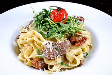 Tagliatelle with mushrooms and dried tomatoes flavored and cheese - 619607352