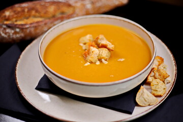 Pumpkin soup with croutons and croutons - 619607354