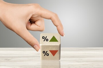 Symbol of interest rate. wooden cube with arrow