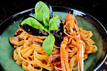 Tagliatelle with seafood quenched with white prosecco - 619607396
